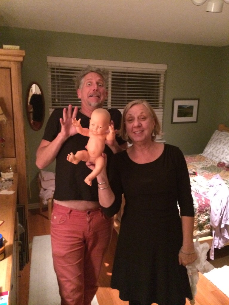 a couple with a fake scary baby